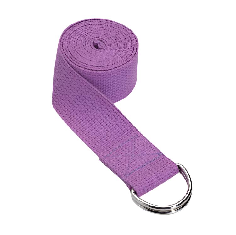 Purple yoga strap rolled up